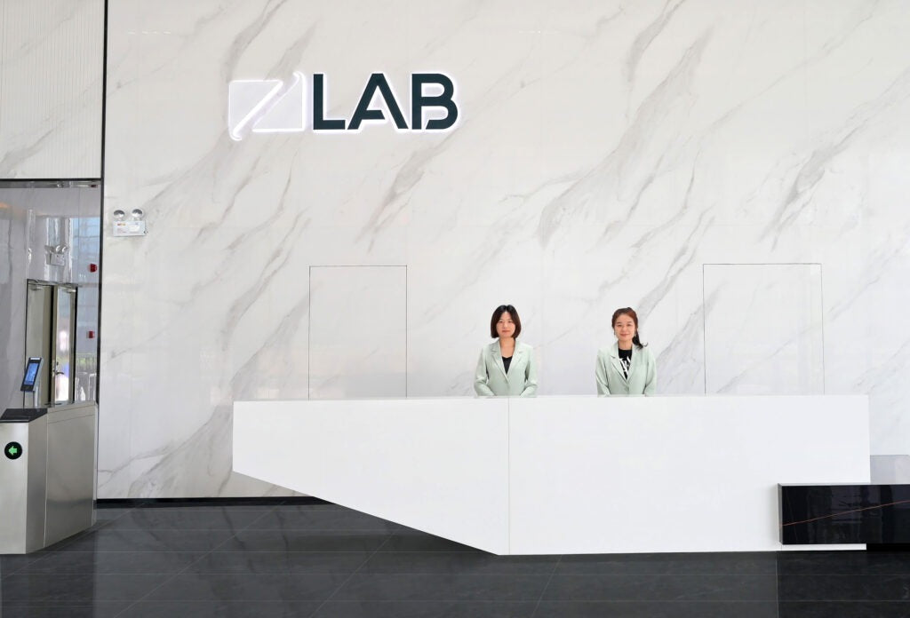 Two women sitting at the reception desk in the ZLab building