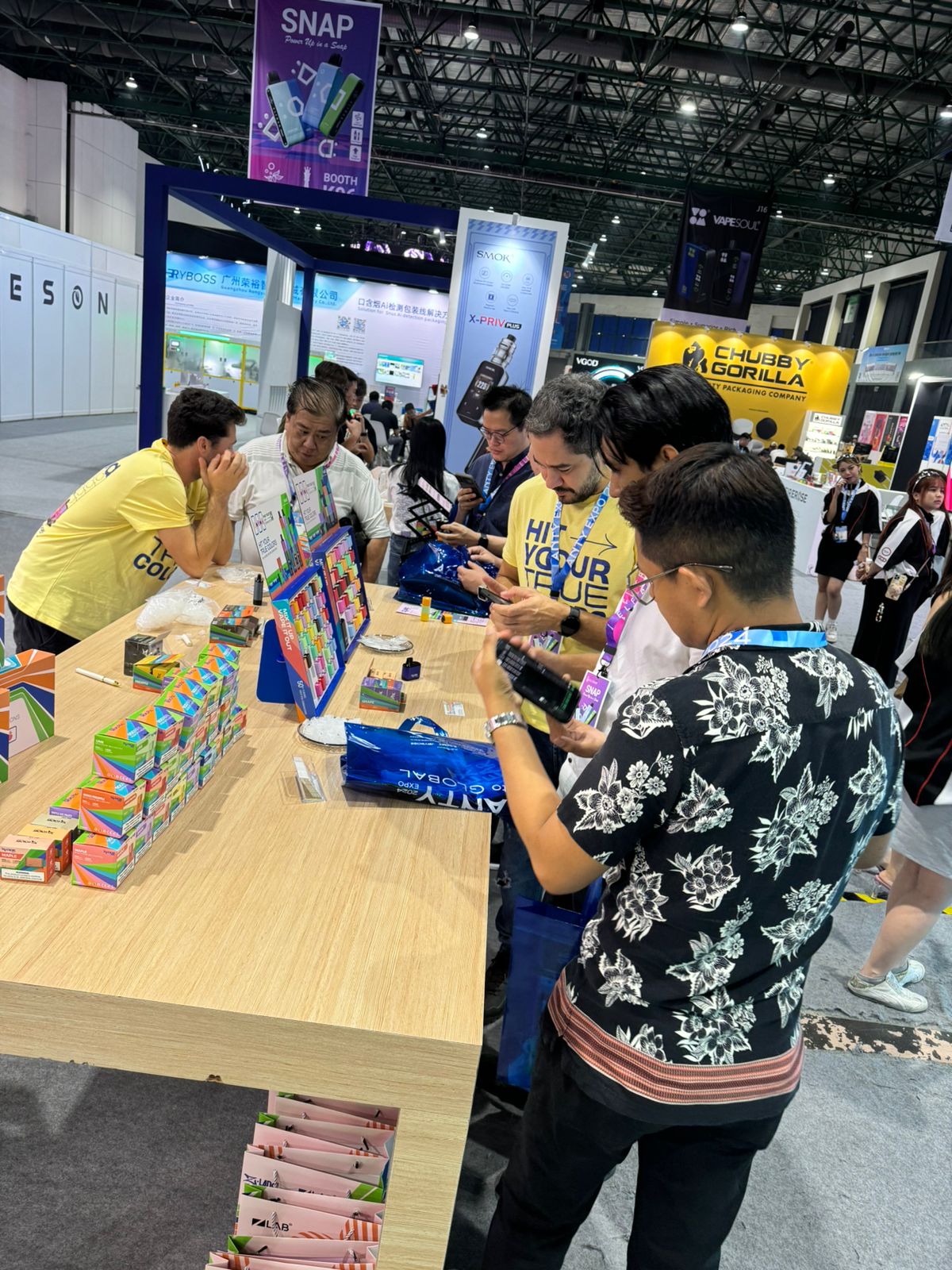 A crowd gathered around the ZLab booth at a trade show
